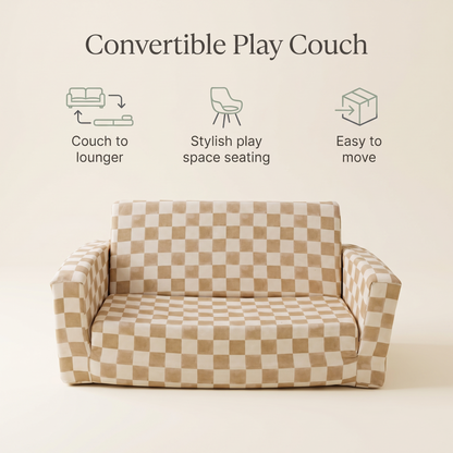Modular checker toffee play couch pieces stacked into a fort in a living room