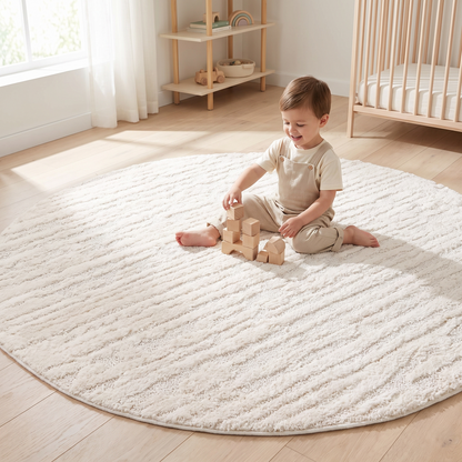 Plush cream round rug styled in a kids playroom reading corner