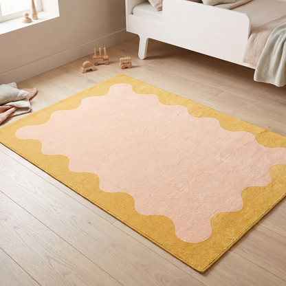 Little Teekie pink and yellow wiggle border washable kids rug in a playroom