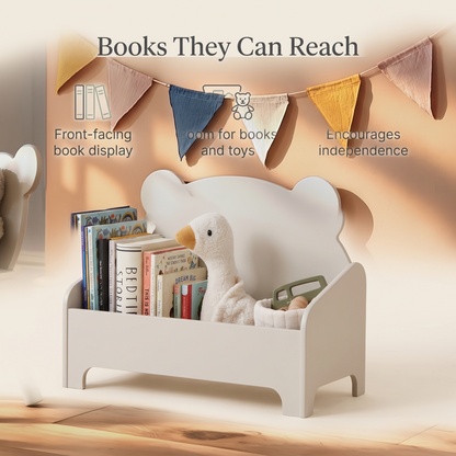 Pebble bear book storage beside a toddler bed in a bright bedroom