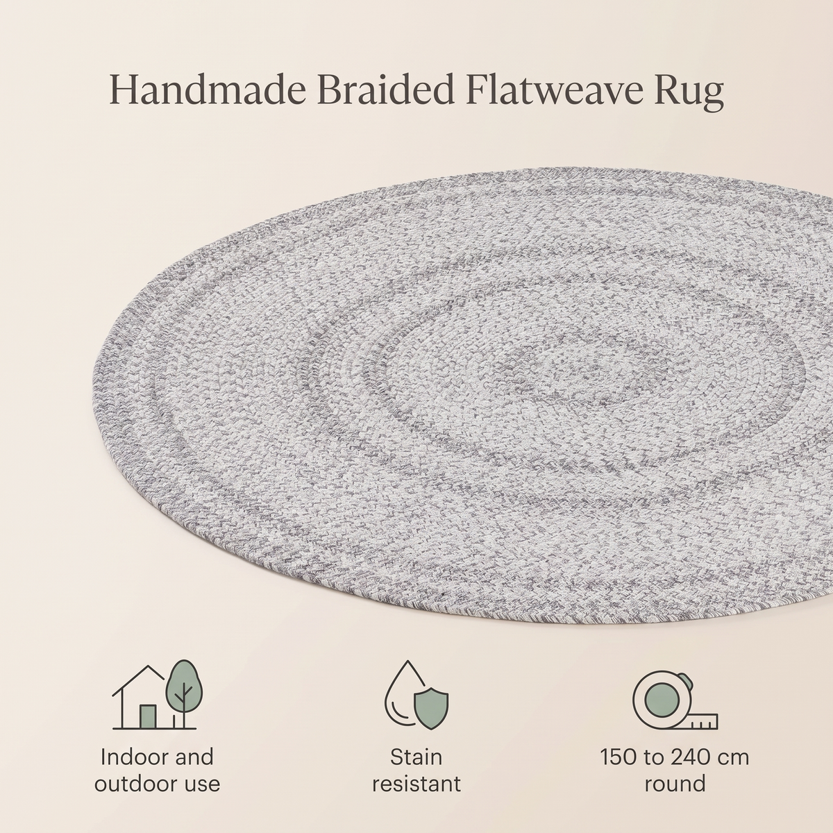 Grey braided round rug in a bright kids bedroom with toys