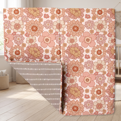Blooms floral print organic cotton padded play mat on a living room floor