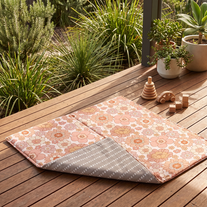 Blooms padded play mat set up for tummy time in a bright playroom