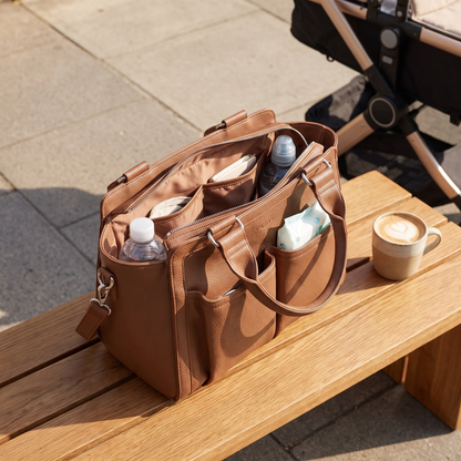 Little Teekie Convertible Pram Caddy | Vegan Leather, Insulated Bottle Pockets – Pebbled Tan – styled in a park setting
