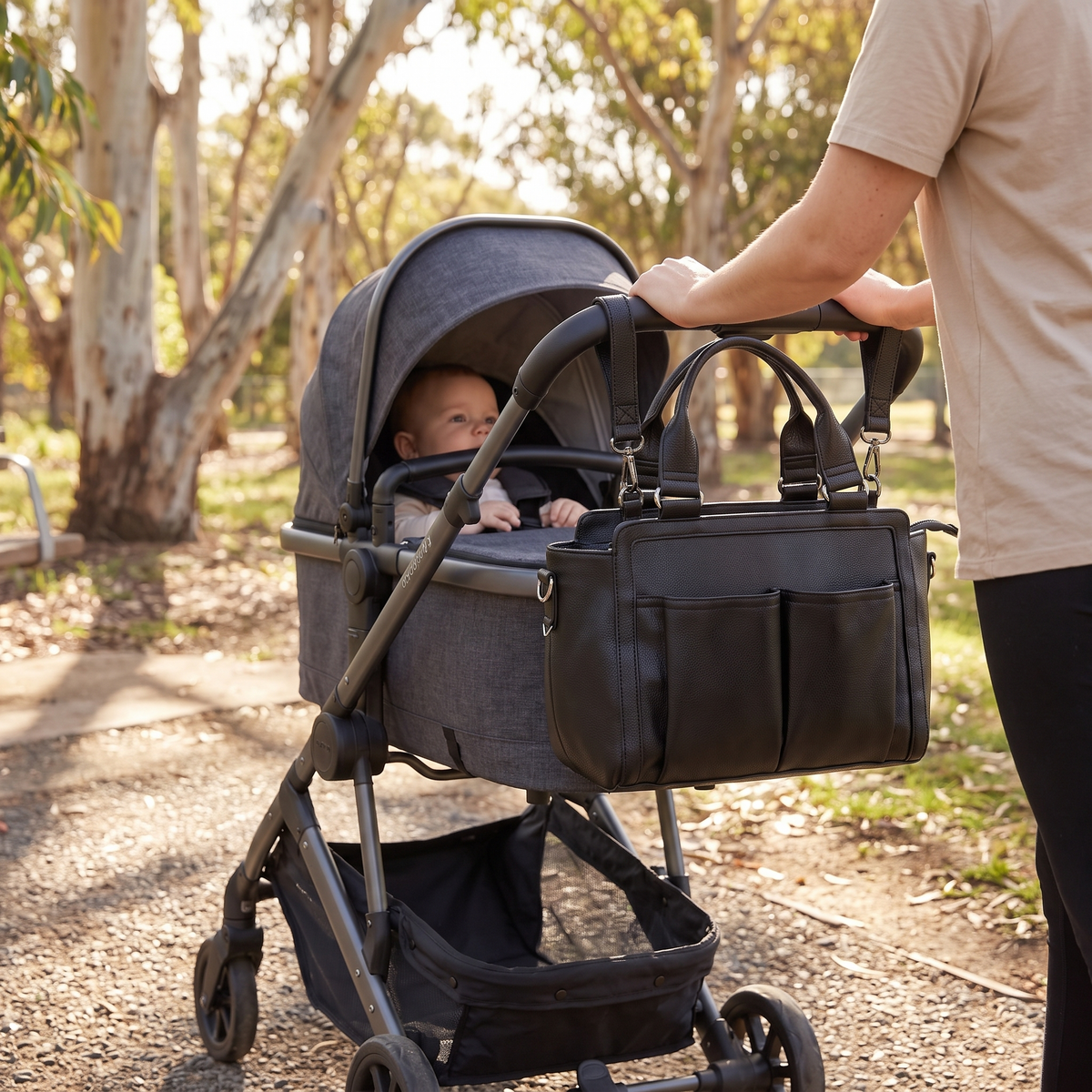 Little Teekie Convertible Pram Caddy | Vegan Leather, Insulated Bottle Pockets – Black – in use, shows scale