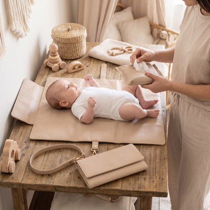 Little Teekie 3-Piece Changing Set | Vegan Leather Clutch, Change Mat & Wipes Case – Oat – in use, shows scale