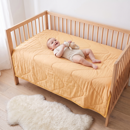 Little Teekie Quilted Bamboo Cotton Cot Bedspread | Plain Dyed, Cot Size – Butter Yellow – in use, shows scale