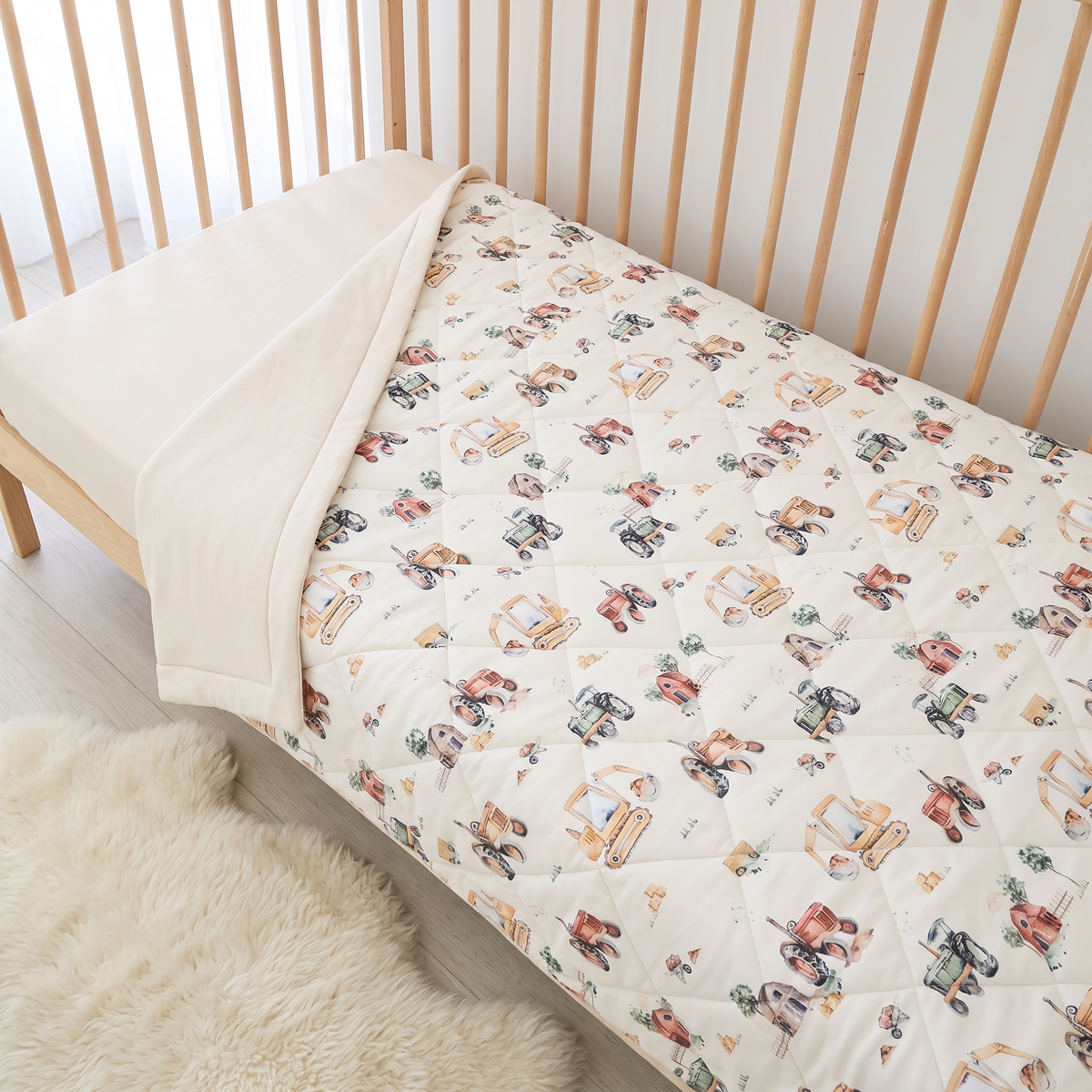Little Teekie Reversible Quilted Organic Jersey Cot Comforter | 100x120cm – Vehicles Print – lifestyle hero