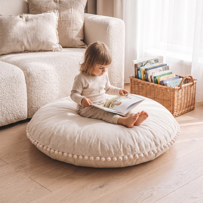 Little Teekie Large Pom-Pom Floor Cushion Cover | Cotton 90cm Kids Floor Pillow – Ecru – in use, shows scale