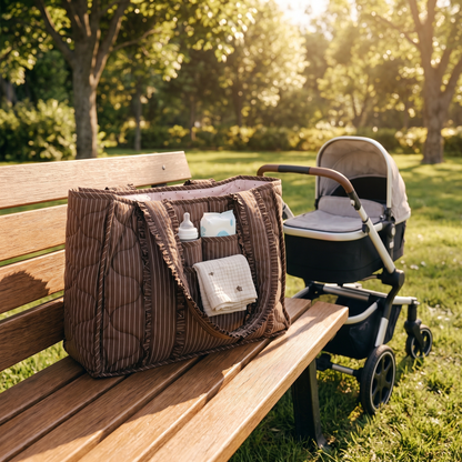 Little Teekie Quilted Nappy Tote | Puffer Cotton, Lightweight Baby Bag – Cocoa Pinstripe – styled in a café setting