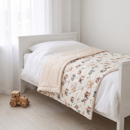 Little Teekie Reversible Quilted Organic Jersey Cot Comforter | 100x120cm – Vehicles Print – styled in a toddler bedroom