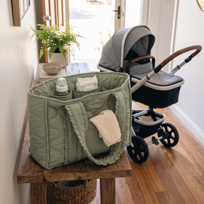 Little Teekie Quilted Nappy Tote | Puffer Cotton, Lightweight Baby Bag – Sage – styled in a café setting