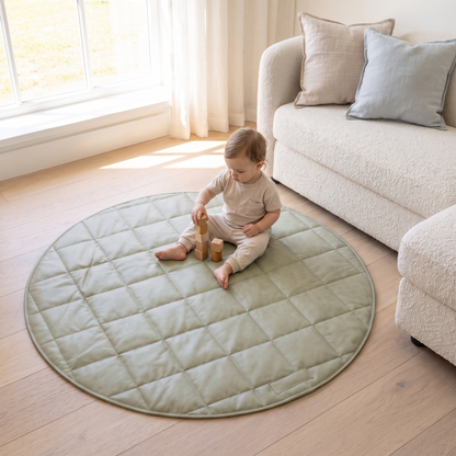 Little Teekie Vegan Leather Quilted Round Play Mat | Waterproof 120cm with Tote – Sage – in use, shows scale