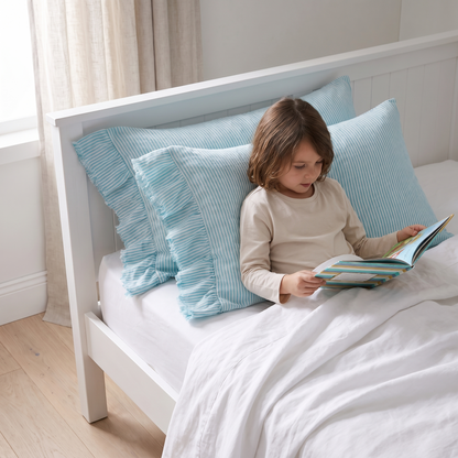 Little Teekie Ruffle-Edge Linen Pillowcase Pair | Standard 48x73cm – Lagoon Stripe – in use, shows scale