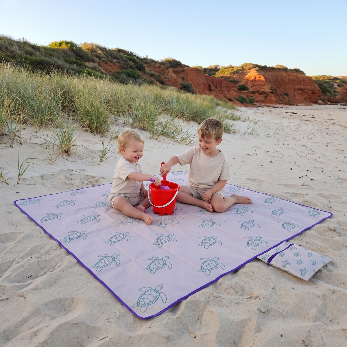 Little Teekie Kids Sand-Free Beach Mat | Compact 1.8x1.8m Reversible, 600g – Turtle Print – in use, shows scale