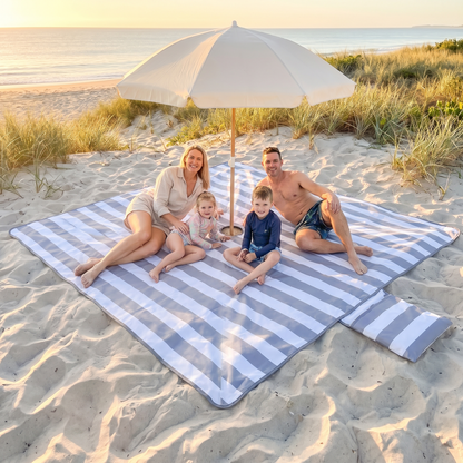 Little Teekie Sand-Free Beach Mat | XL 3.3x3.3m with Umbrella Hole & Beach Bag – Cool Grey Stripe – in use, shows scale