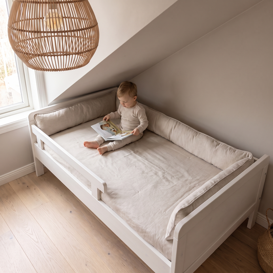 Little Teekie Toddler Bed Bumper | Organic Cotton, Kapok Fill 28x210cm – Oat Linen – in use, shows scale