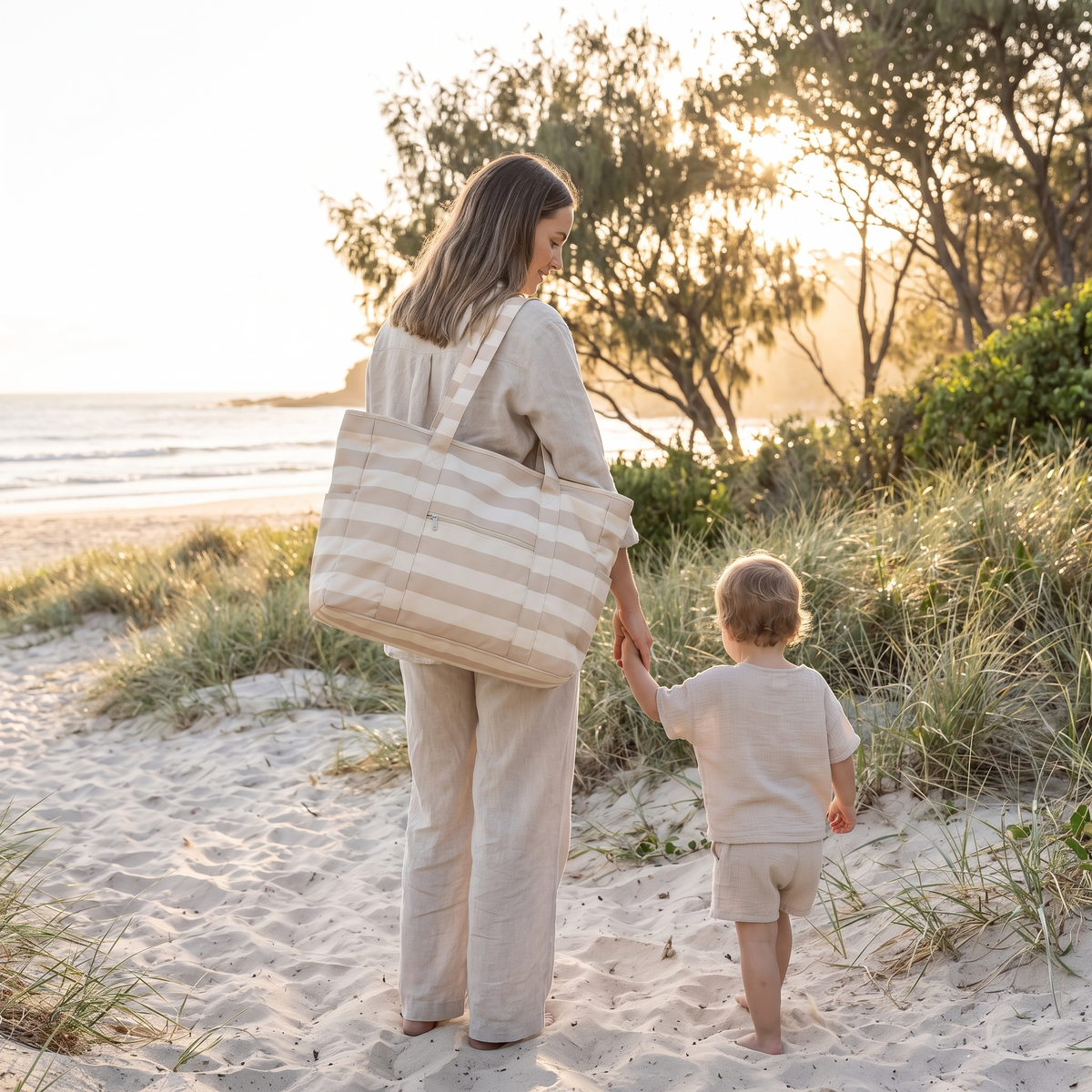 Little Teekie Woven Beach Bag | Recycled Tote, Pairs with Picnic Rugs – Natural Stripe – in use, shows scale