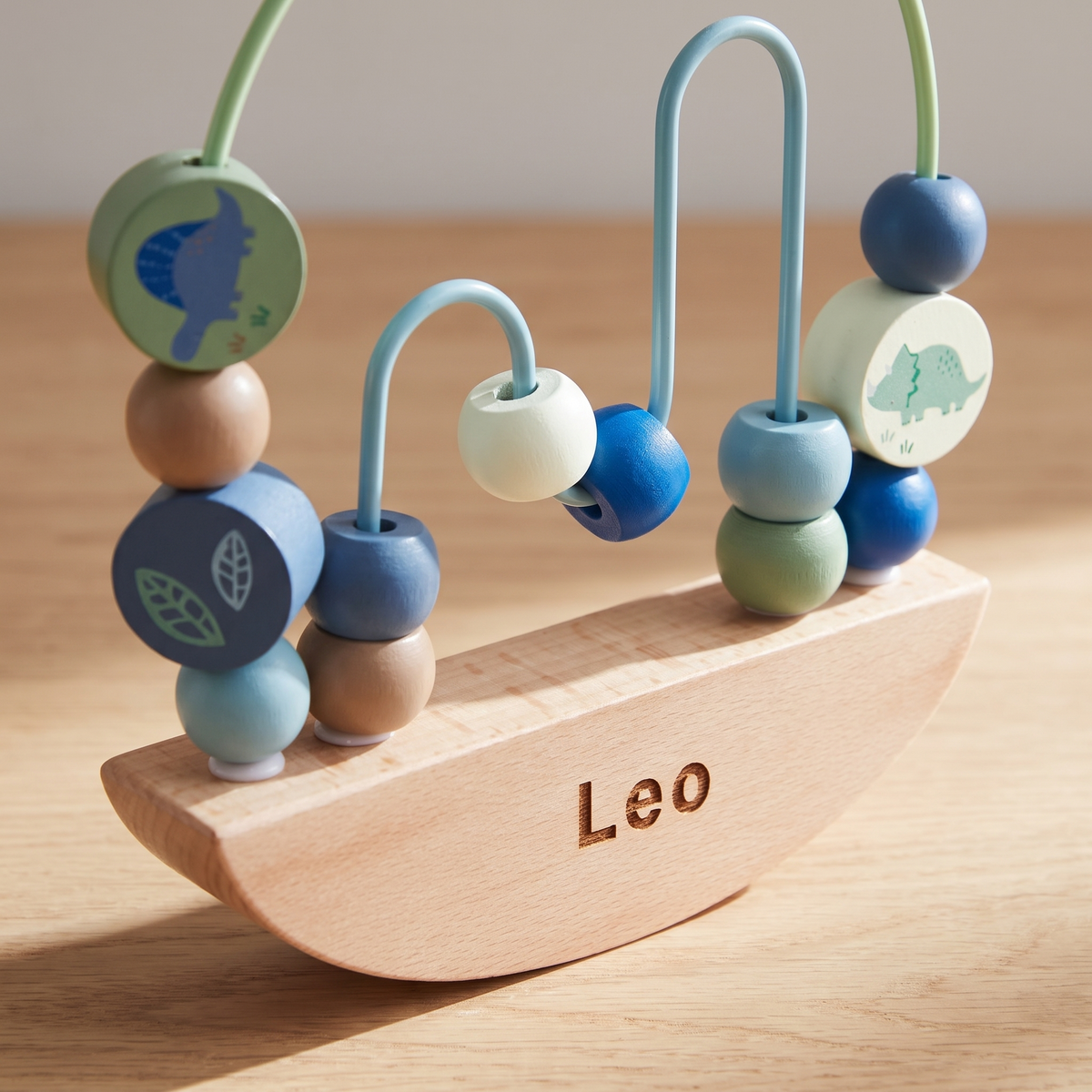 Little Teekie Personalised Wooden Dino Rocking Bead Toy | Name on Base, FSC Timber – personalisation detail