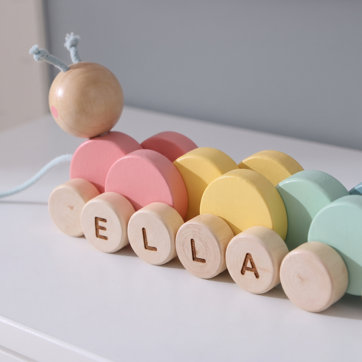 Little Teekie Personalised Wooden Pull Along Caterpillar | Engraved Name, Cherry Wood – Rainbow – personalisation detail
