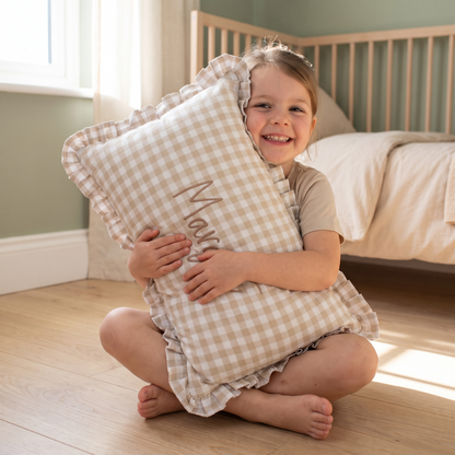 Little Teekie Personalised Gingham Ruffle Cushion Cover | Embroidered Name, 55 x 35cm – Beige – in use, shows scale