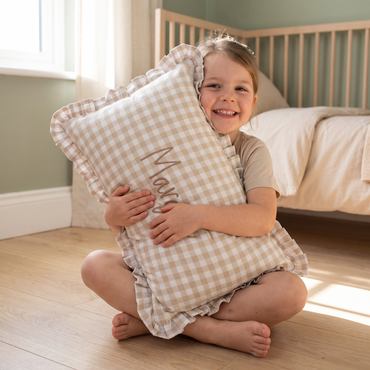 Little Teekie Personalised Gingham Ruffle Cushion Cover | Embroidered Name, 55 x 35cm – Beige – in use, shows scale