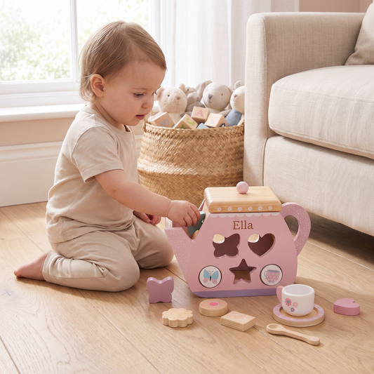 Little Teekie Personalised Wooden Teapot Shape Sorter | Printed Name, Tea Playset – Pink – in use, shows scale