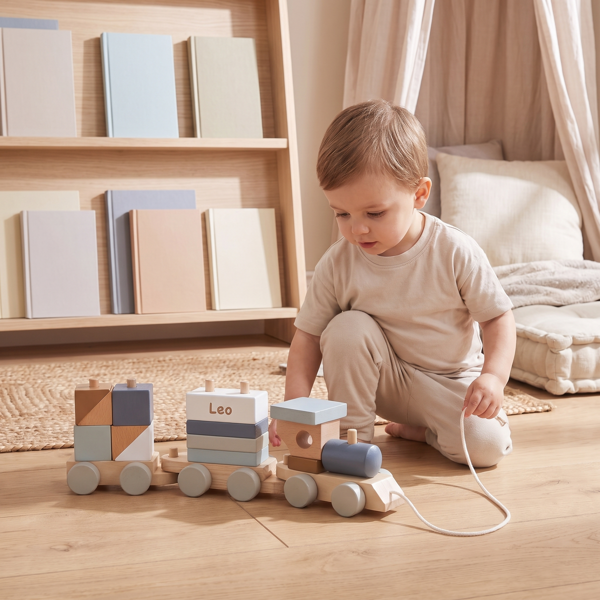 Little Teekie Personalised Wooden Pull Along Train | Stacking Shapes, Name Detail – Blue – in use, shows scale