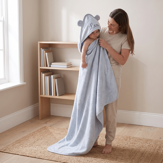 Little Teekie Personalised Hooded Towel | Embroidered Name, Organic Cotton 75 x 75cm – Powder Blue – in use, shows scale