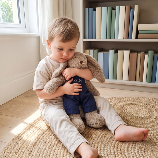Little Teekie Personalised Bunny Soft Toy | Embroidered Name on Overalls, Plush – Navy Blue – in use, shows scale